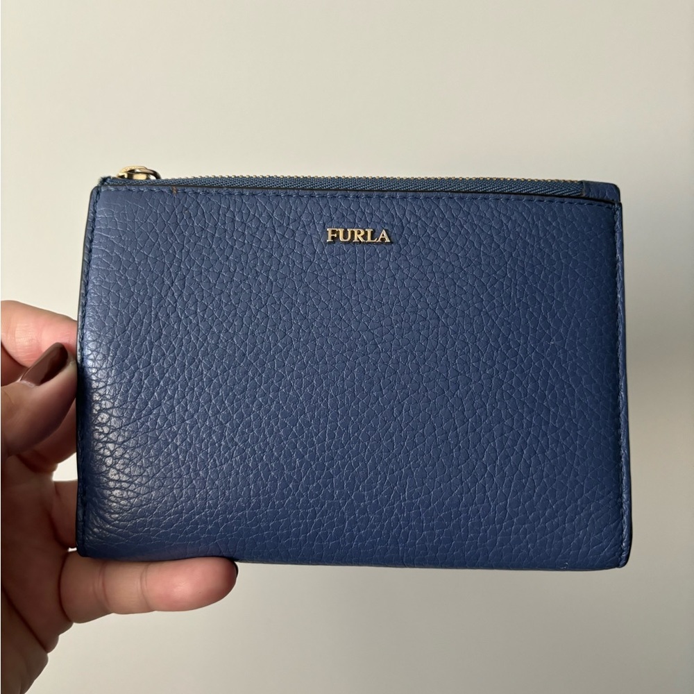 (d) Furla Blue Leather Wallet.